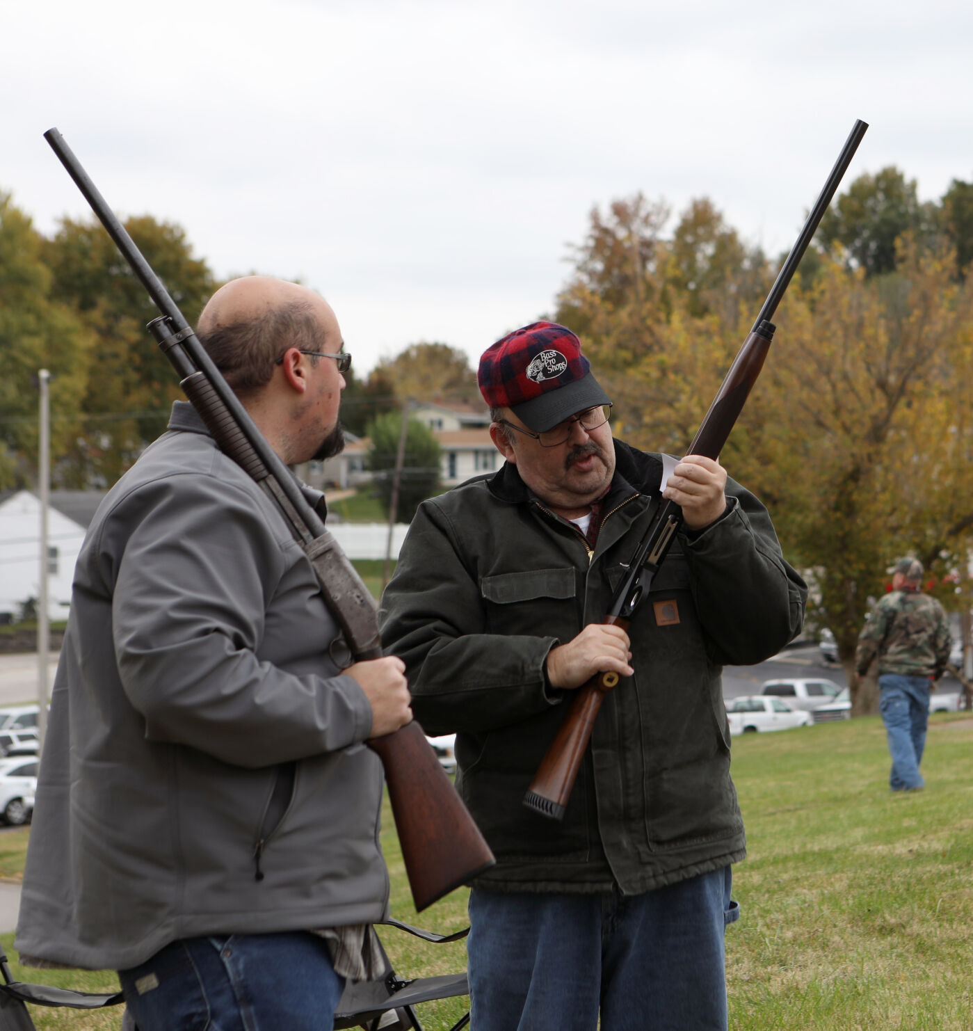 Mike and John Pope inspect their guns